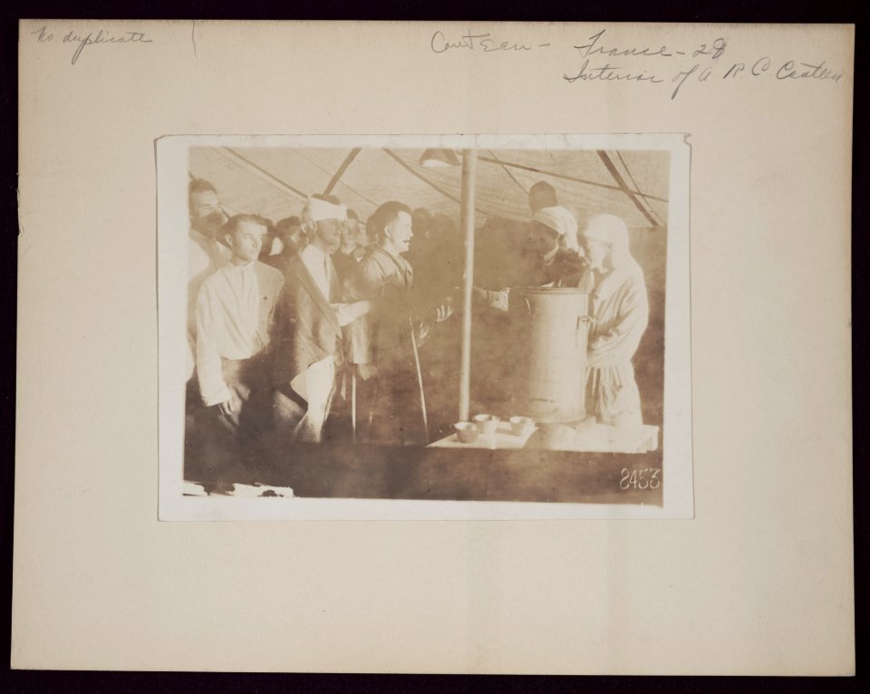 Interior of American Red Cross canteen showing Miss Gladys and Miss Dorothy Cromwell of New York, and Miss Julia Wells of Fairfax, Va. serving chocolate to wounded soldiers American Red LCCN2013649142
