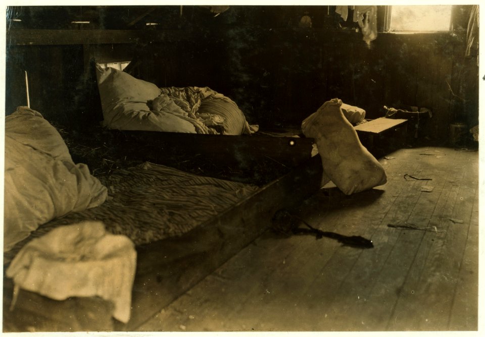 Interior of one family room in upper floor of one of the berry-pickers shacks, Bottomley's farm, near Baltimore. LOC cph.3b38163