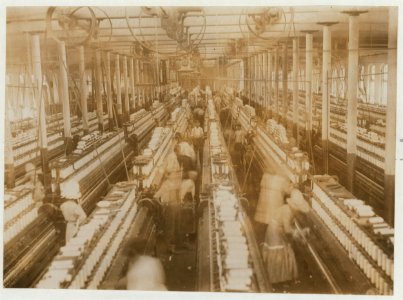 Interior of Magnolia (Miss.) Cotton Mills spinning room. See the little ones scattered through the mill. All work. See also other Magnolia photos and labels. LOC nclc.01871