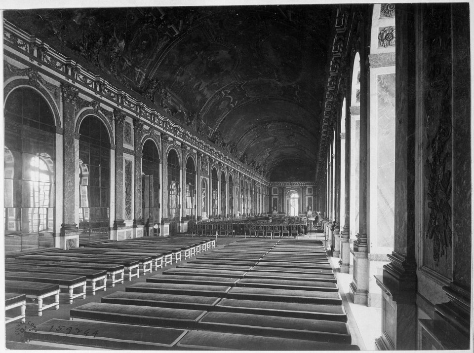 Interior of the Galerie des Glaces showing the arrangement of tables for the signing of Peace Terms, Versailles... - NARA - 531149