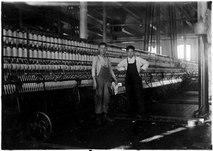Interior of Wamsutta Mill, New Bedford, Mass. Wilfred, youngest boy, appears thirteen years. He has been working a... - NARA - 523508