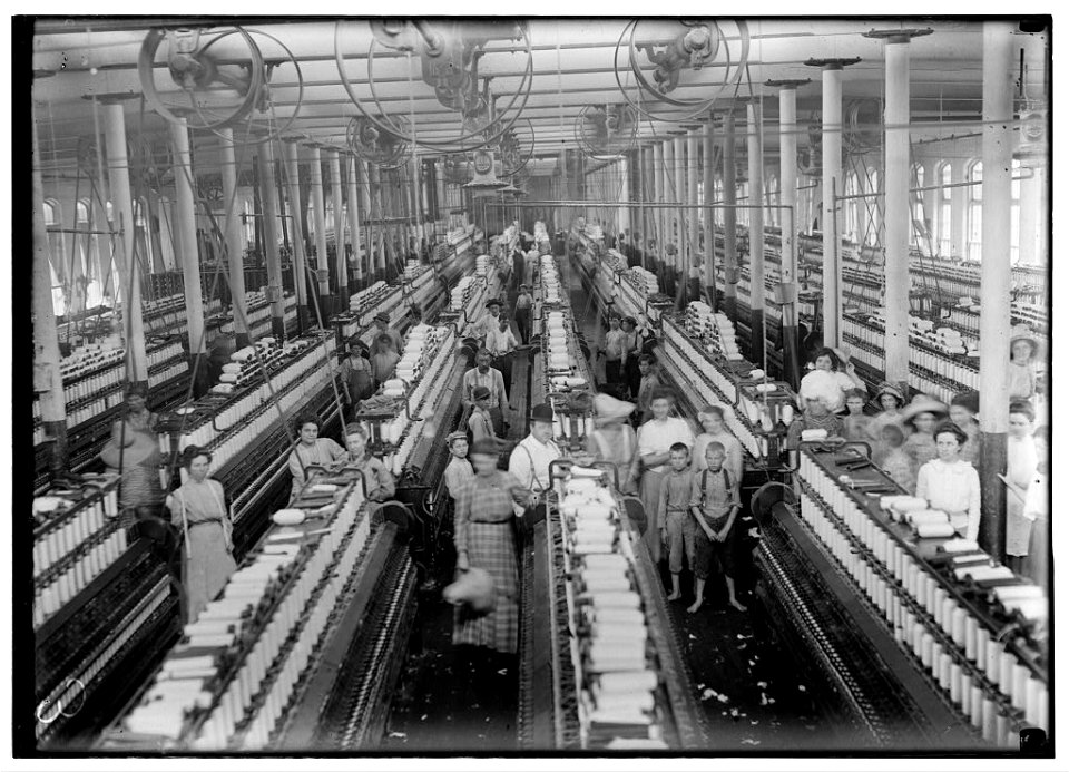 Interior of Magnolia (Miss.) Cotton Mills spinning room. See the little ones scattered through the mill. All work. See also other Magnolia photos and labels. LOC nclc.05456