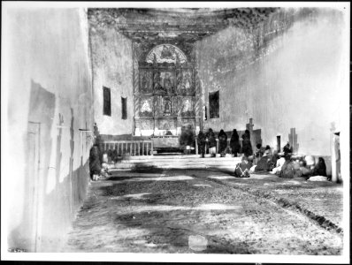 Interior of the old church during early morning mass at the Acoma Pueblo, New Mexico, 1886 (CHS-4541)