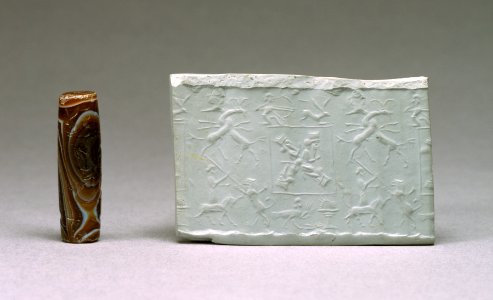Iranian - Cylinder Seal with Heroes Surrounded by Hunters and Animals - Walters 42445 - Profile Impression