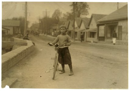 Isaac Boyett, 'I'm de whole show.' The twelve year old proprietor, manager and messenger of the Club Messenger Service, 402 Austin Street, Waco. The photo shows him in the heart of the Red LOC cph.3a31143