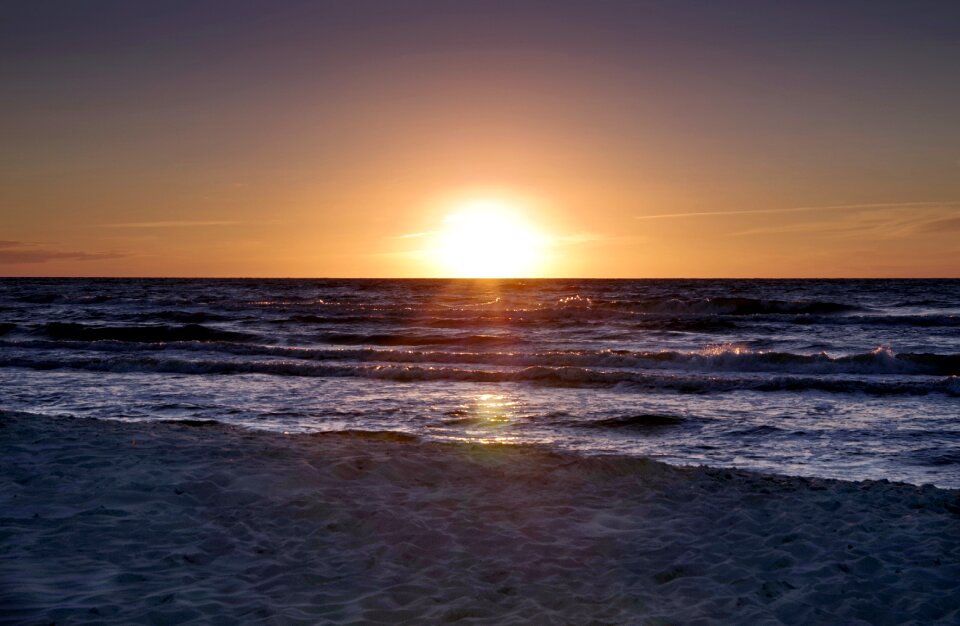 The waves sand the sun