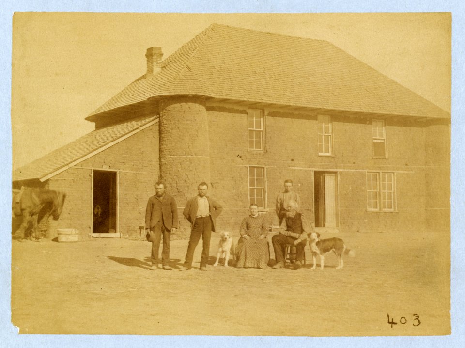 Isadore Haumont and family in front of two-story sod house on French Table north of Broken Bow, Custer County, Nebraska LCCN2005693385
