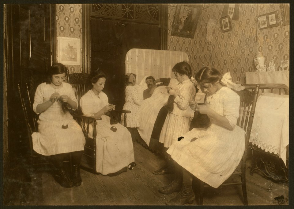 Italian family crocheting bags. Father sick in bed (not contagious). (For complete details see Miss E.C. Watson's report.) LOC nclc.04276
