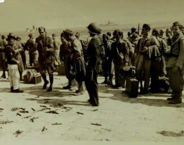 Italian soldiers remove bolts from rifles after U.S. capture of Ustica, off Sicily, Italy, 1943 (78249) (22610522415)
