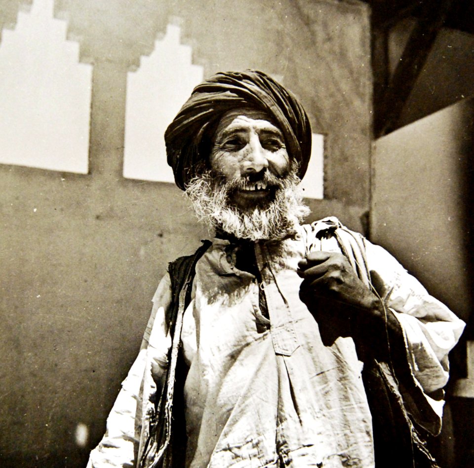 Happy man leaving market with goods purchased at Allied market, Mejez-El-Bab, Tunisia, 1943 (35486735655)