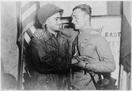 Happy 2nd Lieutenant William Robertson and Lt. Alexander Sylvashko, Russian Army, shown in front of sign (East Meets... - NARA - 531276