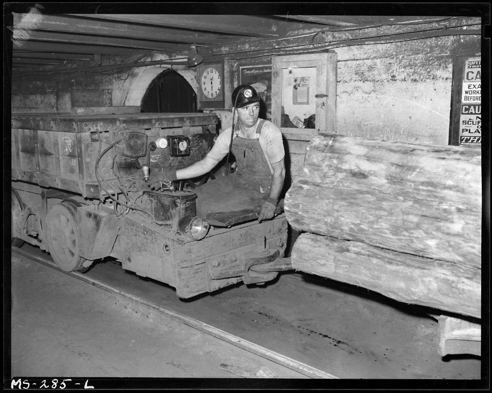 Harold Fickes, motorman, shuttling car load of mine props. Chicago, Wilmington & Franklin Coal Company, New Orient... - NARA - 540342