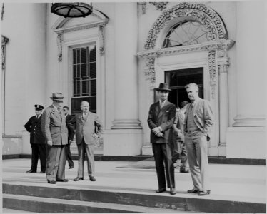Harold Ickes, Henry A. Wallace, and other men standing in front of the White House during ceremonies marking the... - NARA - 199092