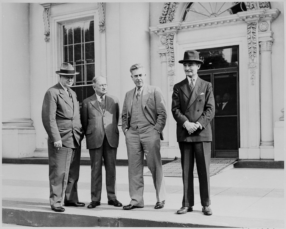 Harold Ickes, Henry A. Wallace, and two other men standing in front of the White House during ceremonies marking the... - NARA - 199087