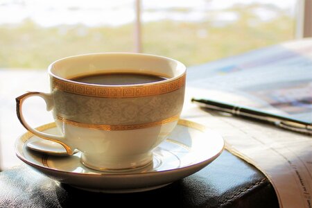 Newspaper drink coffee read newspaper