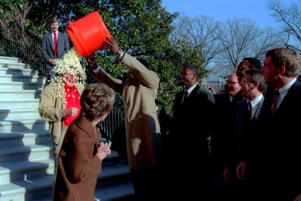 Harry Carson dumping popcorn on President Ronald Reagan