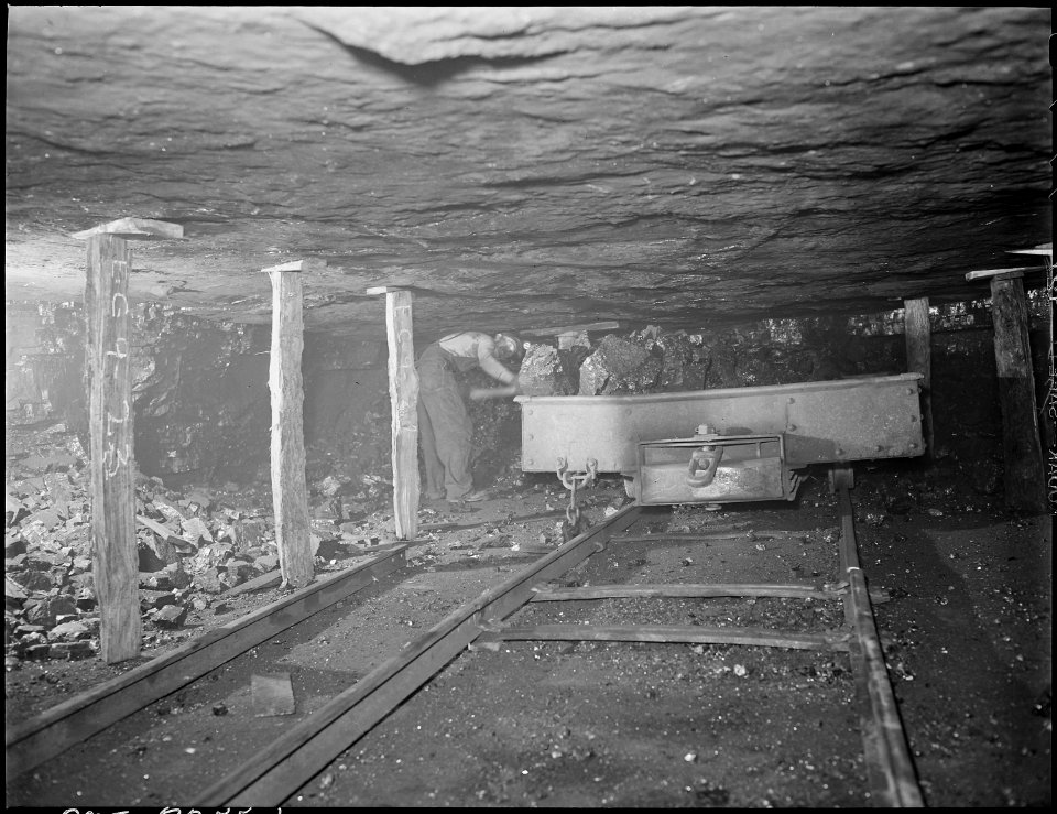 Harry Fain loading coal in room. Coal seam is about 4 feet thick here. Inland Steel Company, Wheelwright ^1 & 2... - NARA - 541485