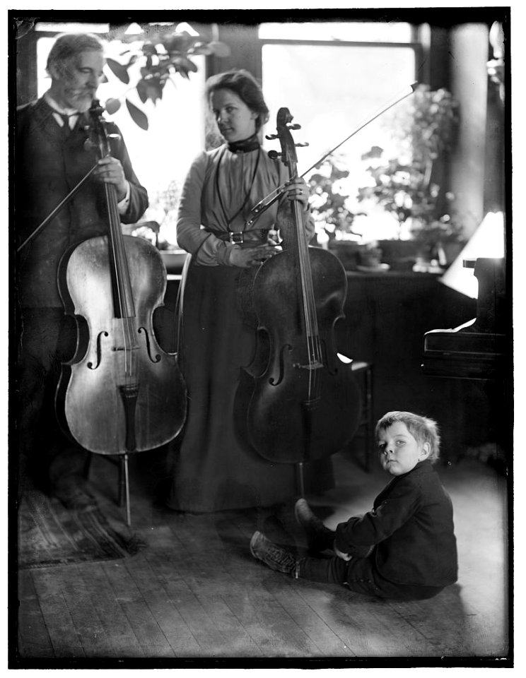 Harmony, a study of the Brundigee family (father, mother and child) and their musical instruments, made in the photographer's New York City studio LCCN2006676255