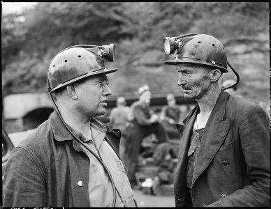 Harry Fain, coal loader, right, talks to his section foreman upon completion of morning shift. Inland Steel Company... - NARA - 541448