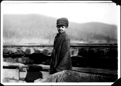 Harley Bruce, a young coupling-boy at tipple of Indian Mine. He appears to be 12 or 14 years old, and says he has... - NARA - 523374 photo