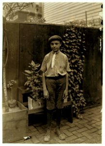 Harry, a Cincinnati boy of 18 years, who attends school and earns $.25 daily, carrying bundles. LOC nclc.03182