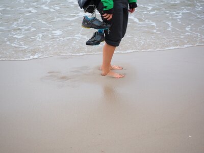 Feet sea sand photo
