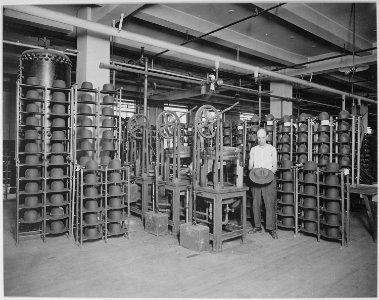 Hats manufactured for American soldiers by John B. Stetson Company, Philadelphia, Pennsylvania. Pressing Army service ha - NARA - 533660 photo