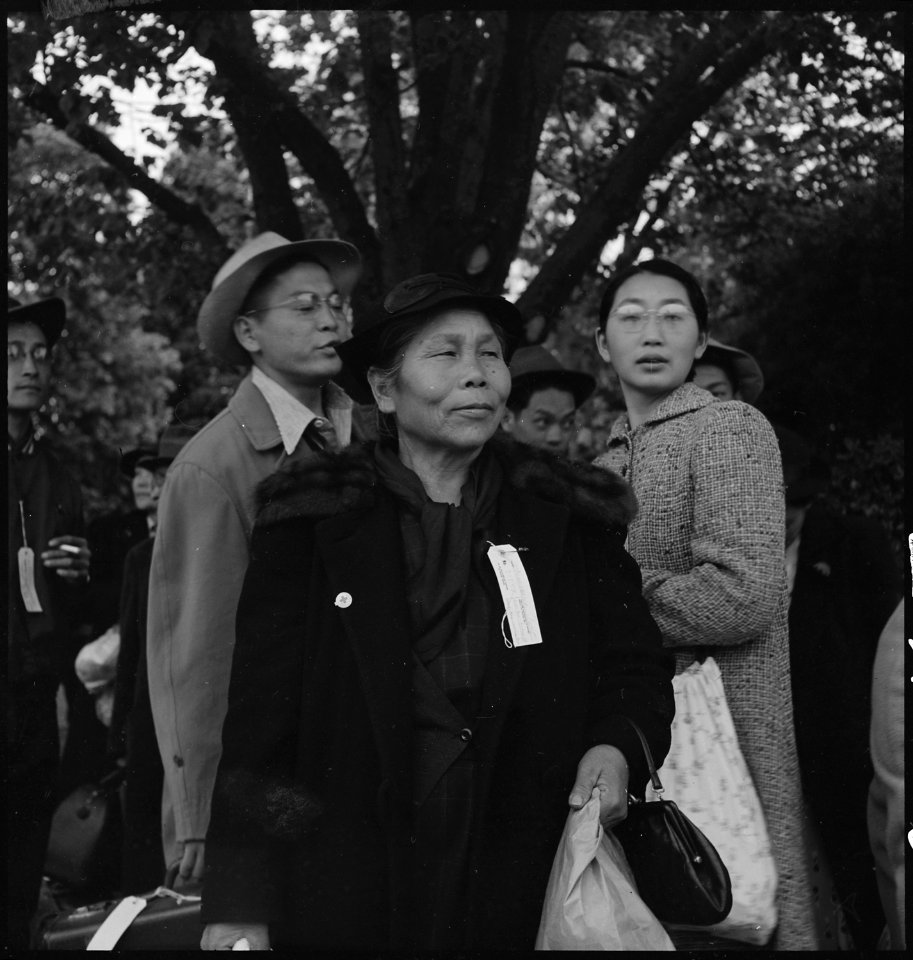 Hayward, California. A mother with her American-born-and-educated children awaiting evacuation bus. . . . - NARA - 537515