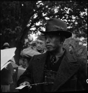 Hayward, California. Farmer of Japanese ancestry is showing his identification card to a Wartime Ci . . . - NARA - 537525