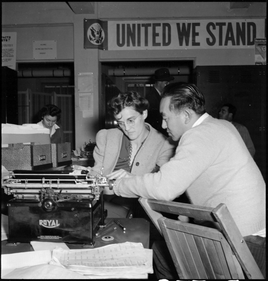 Hayward, California. Harry Konda, farmer, discusses evacuation details with a representation of the . . . - NARA - 536469