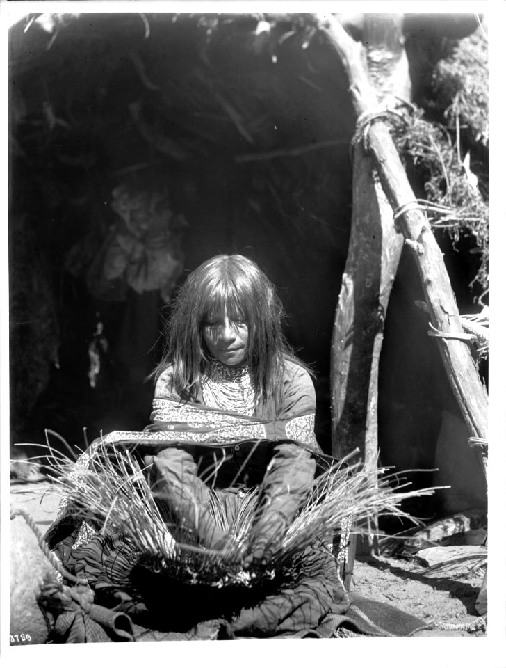 Havasupai Indian woman, Rock Jones' daughter, weaving a basket, ca.1899 (CHS-3789)