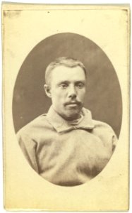Head-and-shoulders portrait of a man, dressed in convict clothing, facing slightly right LCCN99615644