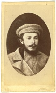 Head-and-shoulders portrait of a man, dressed in convict clothing, facing slightly right LCCN99615646