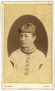 Head-and-shoulders portrait of a young woman, facing left LCCN99615653