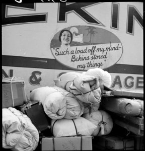 Hayward, California. Baggage of evacuees of Japanese ancestry ready to be loaded on moving van. Ev . . . - NARA - 537501 photo