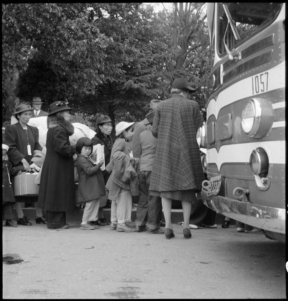 Hayward, California. Farm families of Japanese ancestry are being checked into the evacuation buses . . . - NARA - 537521
