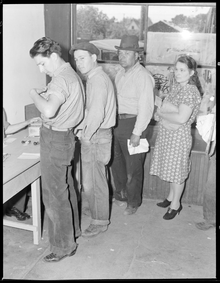 Hayward, California. Youth on Relief. Looking in his pocket for his surplus commodities card. Not having a job is... - NARA - 532121