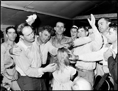 Healing laying on of hands ceremony in the Pentecostal Church of God. Lejunior, Harlan County, Kentucky. - NARA - 541337