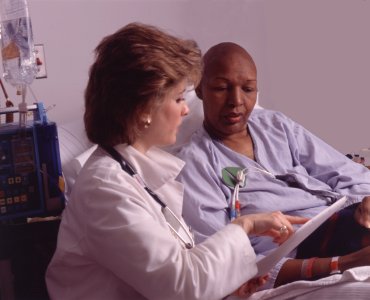 Health professional consults with patient