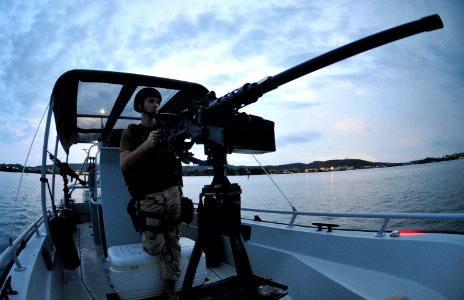 Heavily armed USCG boat patrols Guantanamo Bay -b