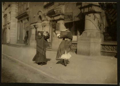 Heavy loads of garments for home-work. Near Bleeker St., N.Y. LOC nclc.04193