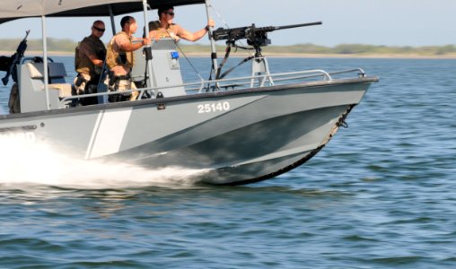 Heavily armed USCG boat patrols Guantanamo Bay -a