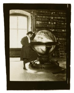 Helen Johns Kirtland leaning on a globe LCCN2005687016