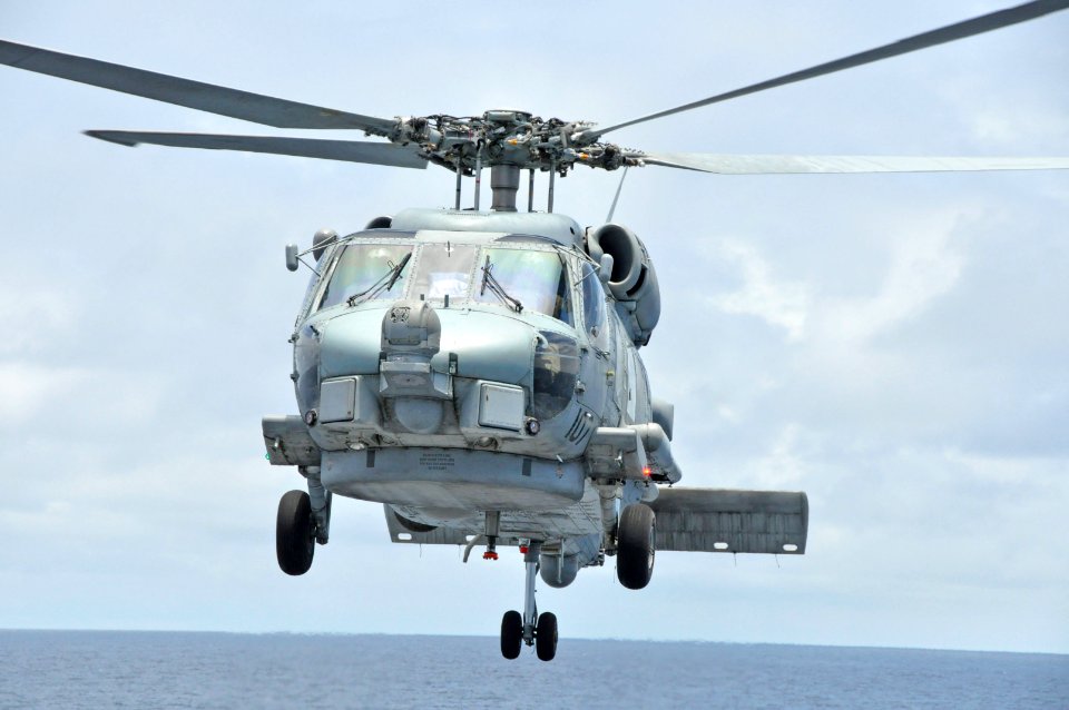 Helicopter takes off from USS Rentz 130921-N-IC228-007