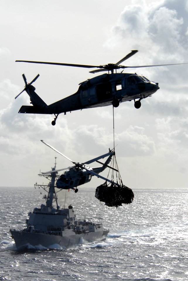 Helicopters and ships work together on vertical replenishment DVIDS110884