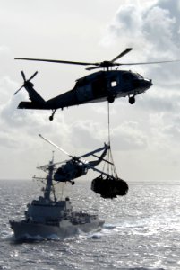 Helicopters and ships work together on vertical replenishment DVIDS110884