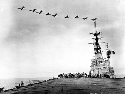 Helldivers flying over carrier Arromanches (R95) in the Gulf of Tonkin c1953