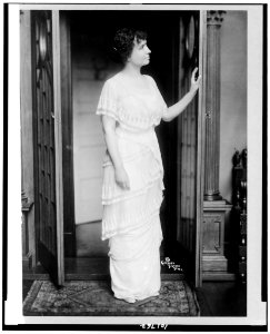 Helen Keller, full-length portrait, standing at door in room, facing right LCCN90715103