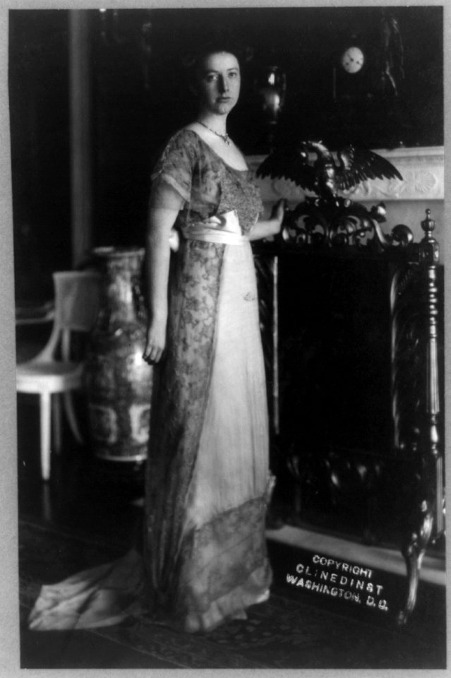 Helen Taft, full-length portrait, standing by fireplace, facing right LCCN97505448