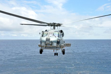 Helicopter takes off from USS Rentz 130921-N-IC228-006